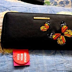 Brand new wallet with 2 compartments for coins, bills, credit cards and phone.